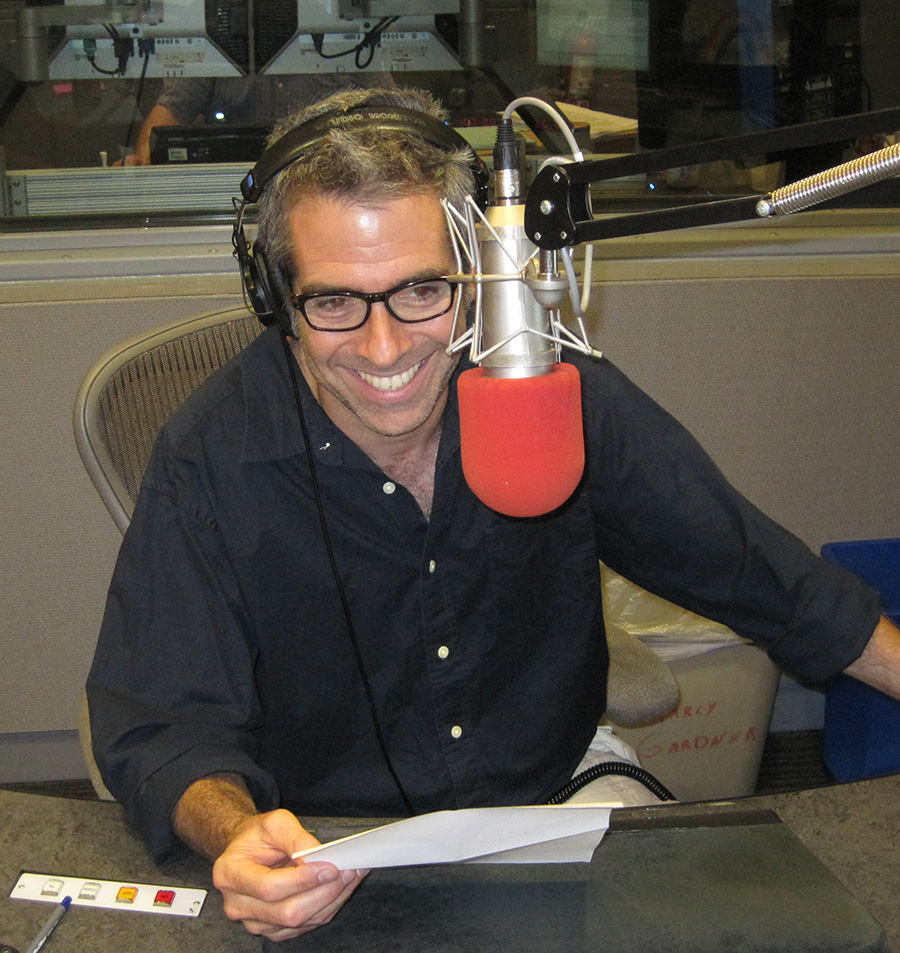 Marco Werman in studio with microphone