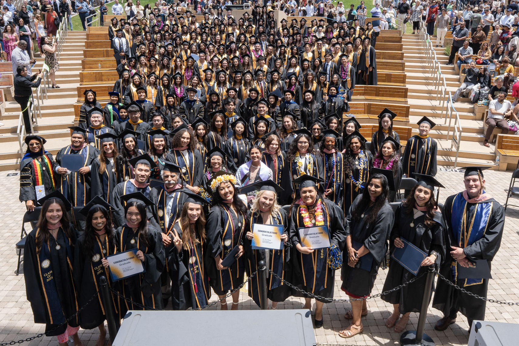 Photo of entire 2025 Herbert Wertheim School of Public Health graduating class in their graduation robes.