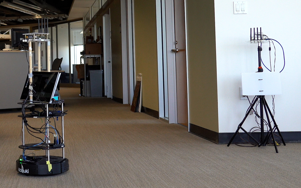 Robot approaches a WiFi access point inside an office.