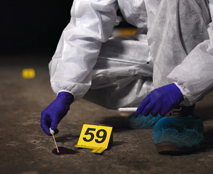 Person collecting forensic evidence