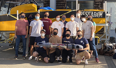 Members of the Yonder Deep team with their AUV