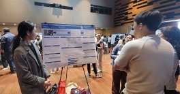 Student presenting her project at the HDSI Senior Capstone Program's poster showcase. 