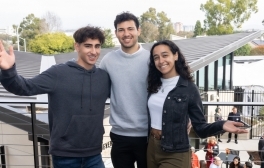 Assaf Cohen-Arazi, Yoni Lalouz and Adee Newman stand on second floor balcony of the new Hillel center.