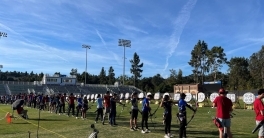 A line of archers stand ready to shoot
