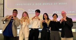 Hassan Akmal, Maria Coates, Brandon Joe, Sabrina Cheng, Victoria Morales Vargas and Tod Oliviere hold up heart hands symbols