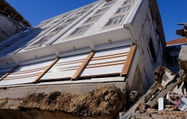 Due to ground liquefaction during the Turkey-Syria quake, this building broke from the foundation and fell on the building behind it.