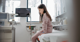 Worried child patient in emergency room.