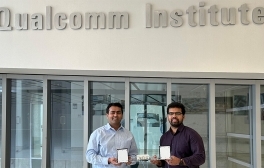Study authors Dinesh Bharadia (left) and Rohith Reddy Vennam (right) stand inside the UC San Diego Qualcomm Institute with a prototype mmSpoof device.