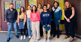 Group of people standing outside smiling at camera