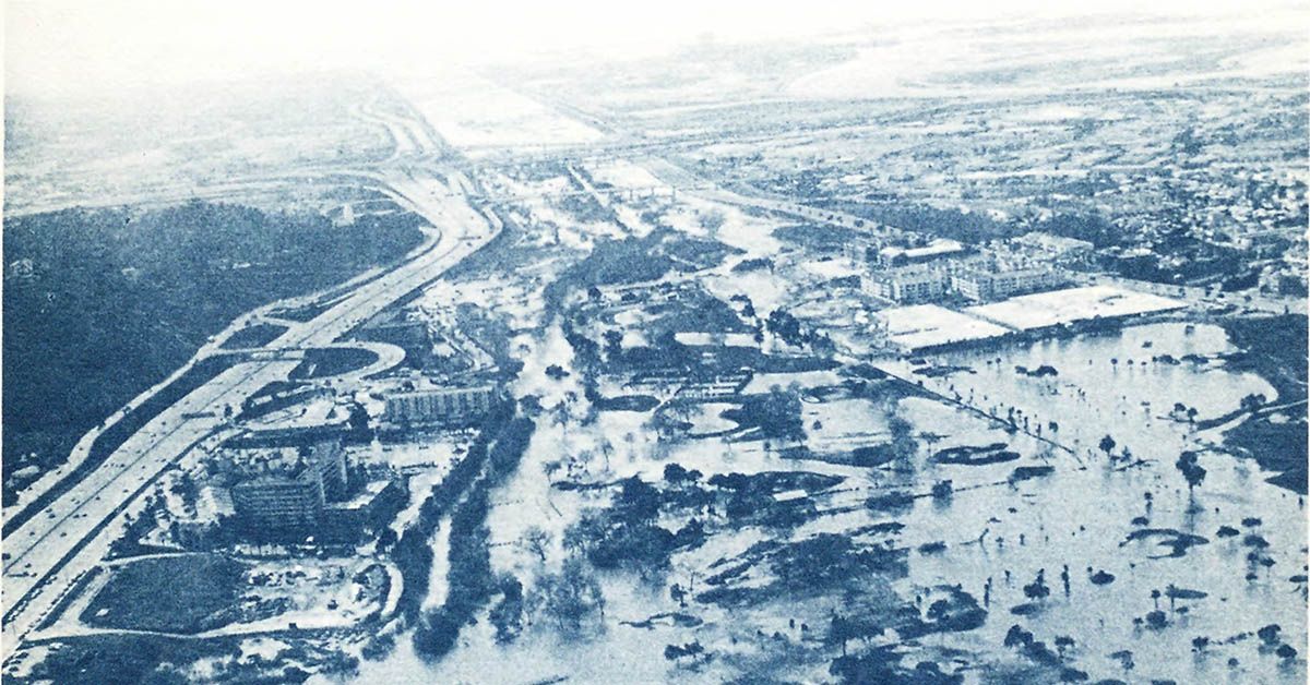 A black and white photo showing flooding in lower Mission Valley, San Diego County, February 1980.