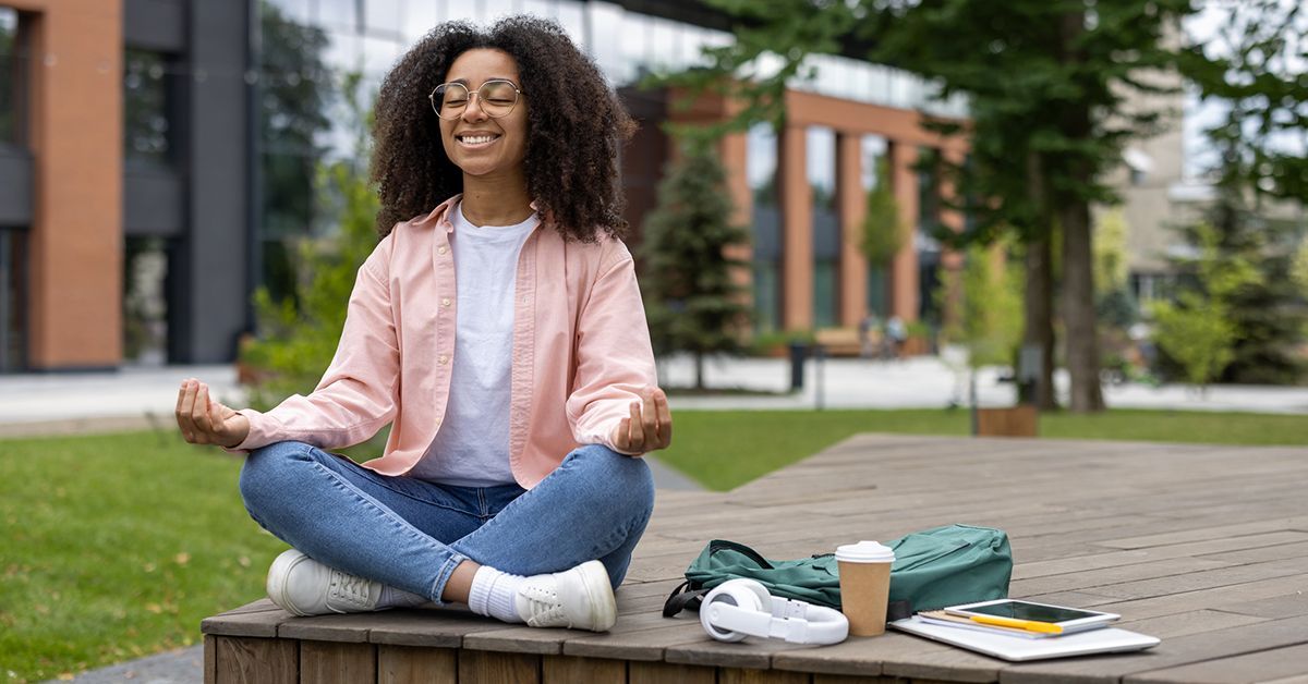 Girl meditating on college campus