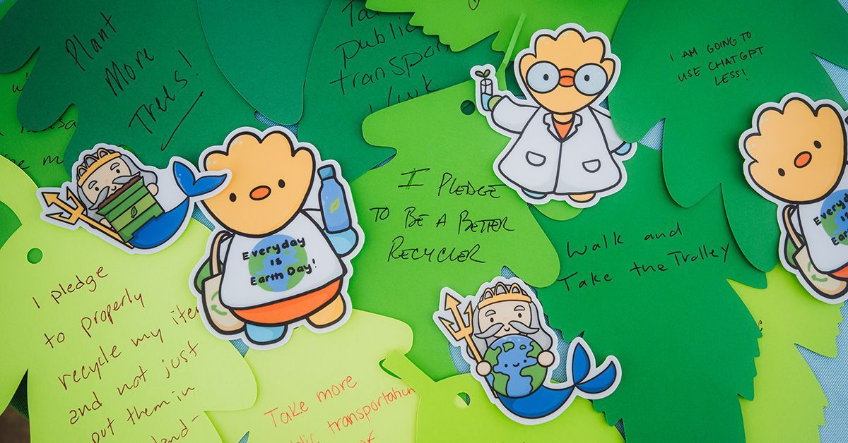 A collage of sustainability pledges in the shape of leaves. 
