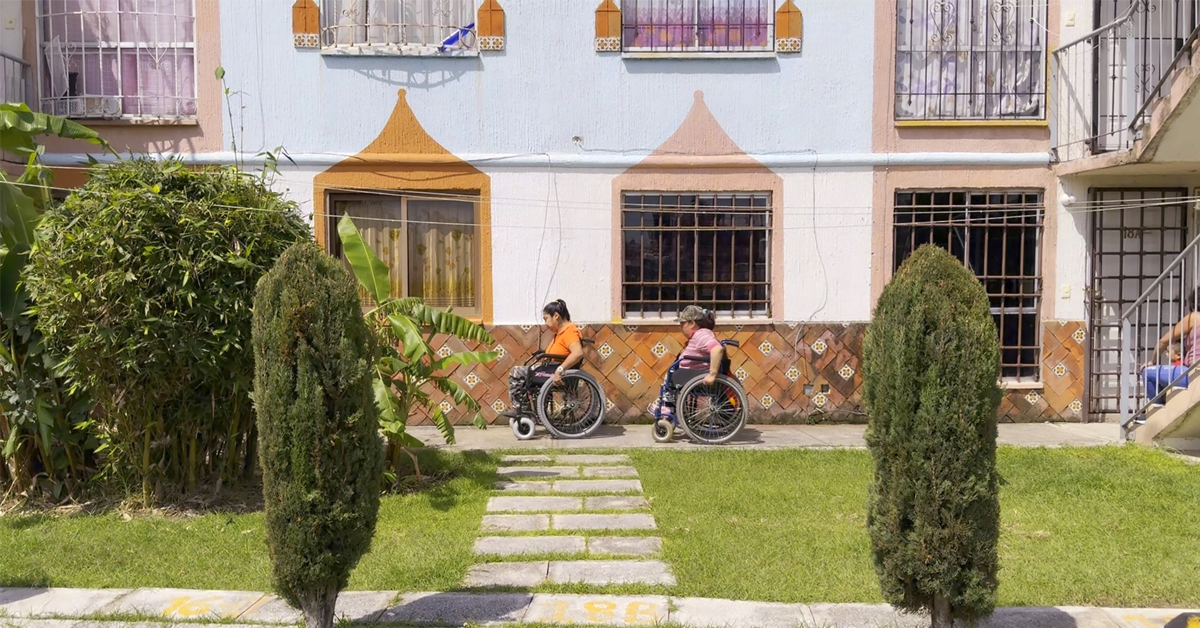 Film still with Rosalinda and Diana leaving their home