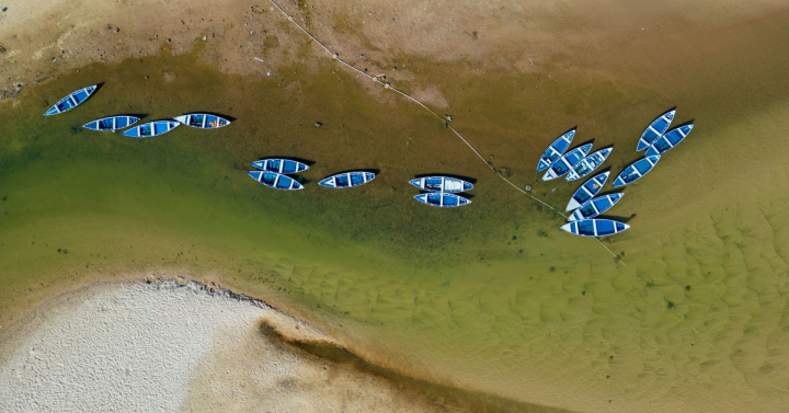 Small boats stranded in the nearly dry bed of the Tapajos River in Alter do Chao, Santarem, Brazil, during the El Niño-fueled Amazonian drought in 2023. Photo: Tarcisio Schnaider/iStock