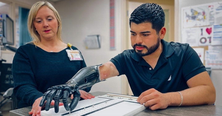 Christian Arreola with bionic hand during rehab session.