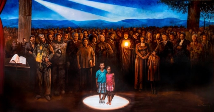 A mural entitled the Black Legacy Mural by Andrea Rushing depicts Black leaders throughout history behind two black children of a future generation.