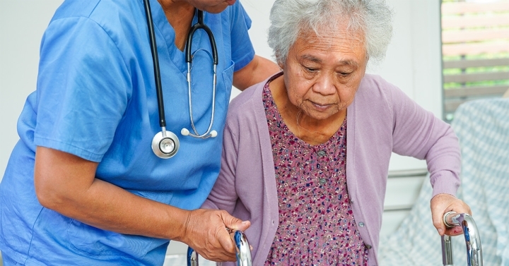 nurse helping a senior patient