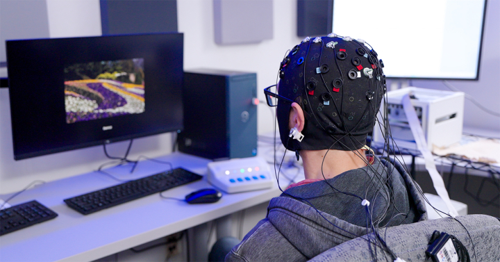 Patient wearing head gear for study