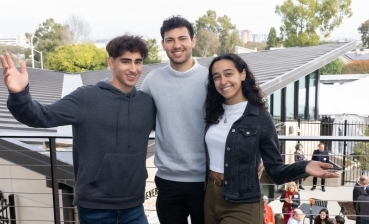 Assaf Cohen-Arazi, Yoni Lalouz and Adee Newman stand on second floor balcony of the new Hillel center.