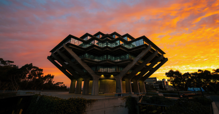 Geisel Library against a sunset