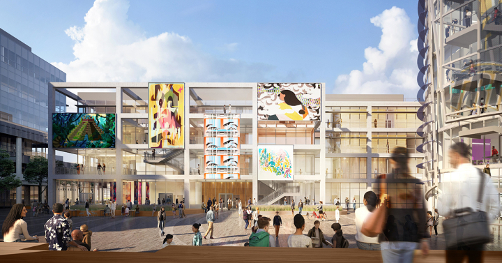 A four-story building located on a plaza.