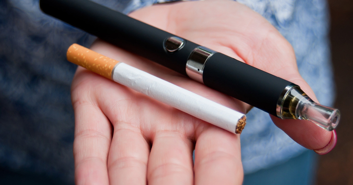 Closeup of hand of woman with e-cigarette