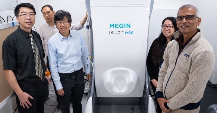 Video: Group standing with MEG machine