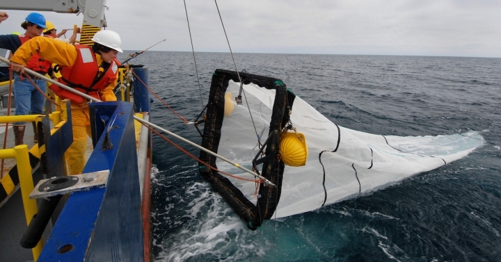 A net is deployed from a research vessel 