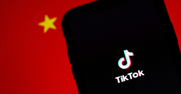 TikTok logo in front of the Chinese flag.