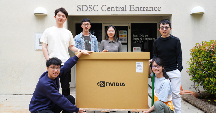 Members of the Hao Lab with the NVIDIA gift, still boxed, outside of SDSC. Top row (left to right): Lanxiang Hu, Yichao Fu, Mingjia Huo, Hao Zhang. Second row (left to right): Peiyuan Zhang, Junda Chen. Photo courtesy of SDSC.
