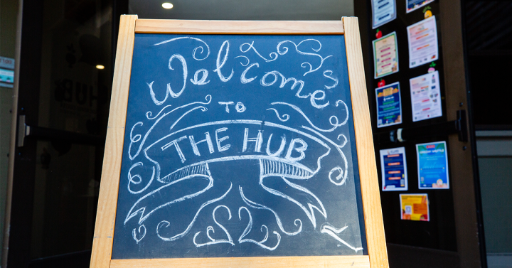 Chalkboard welcome sign for the The Hub Basic Needs Center at UC San Diego