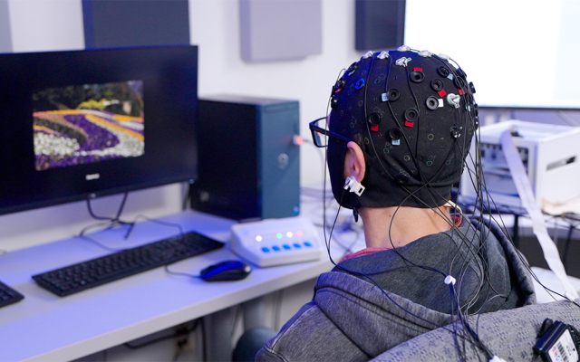 Patient wearing head gear for study