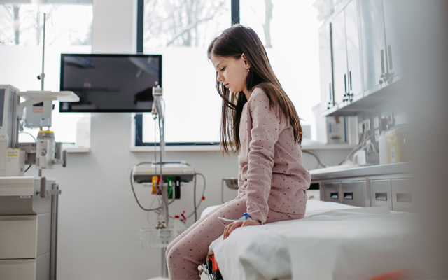 Worried child patient in emergency room.