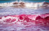 Pink waves crashing along the San Diego coast