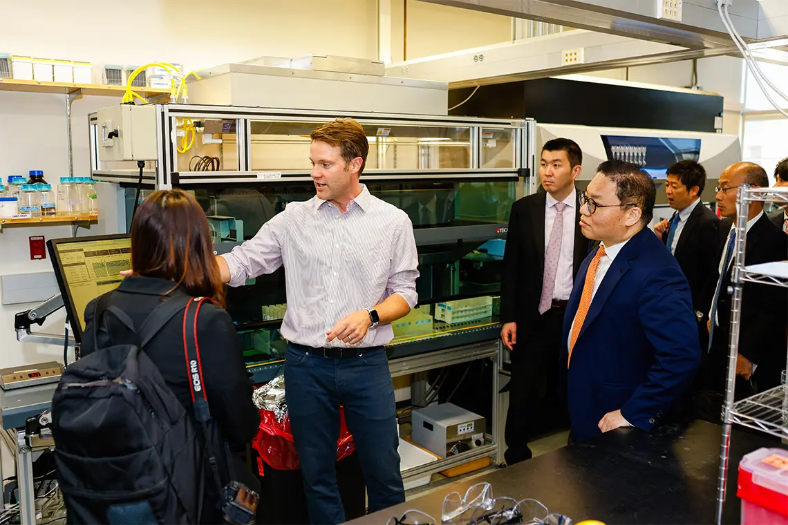 Adam Feist in lab with others