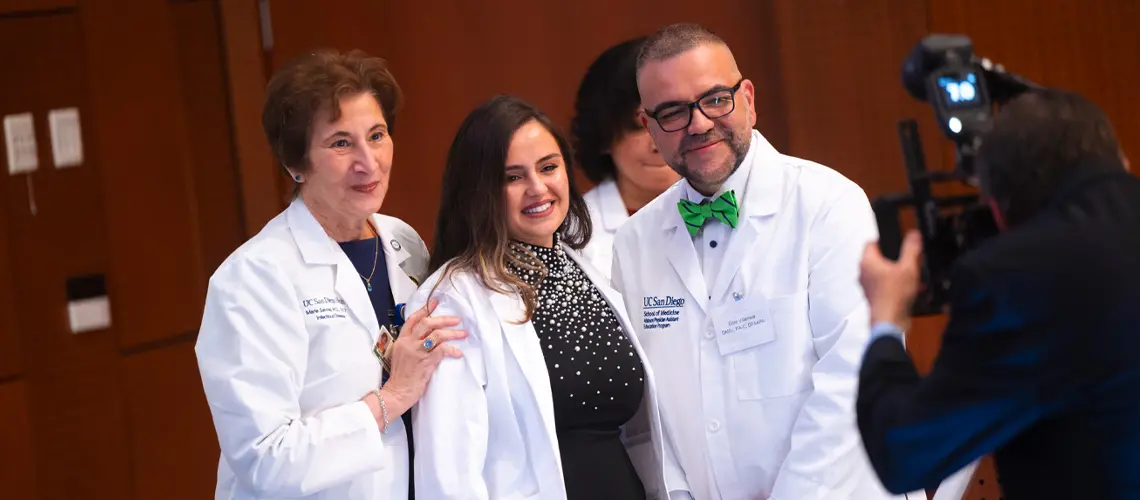 Maria Savoi, M.D. and Elias Villareal, DMSc, PA-C, pose with a female student