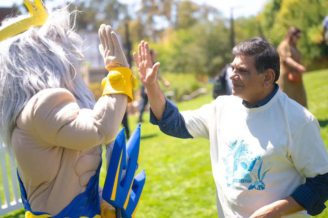 Niraj Dangoria gives King Triton a high five