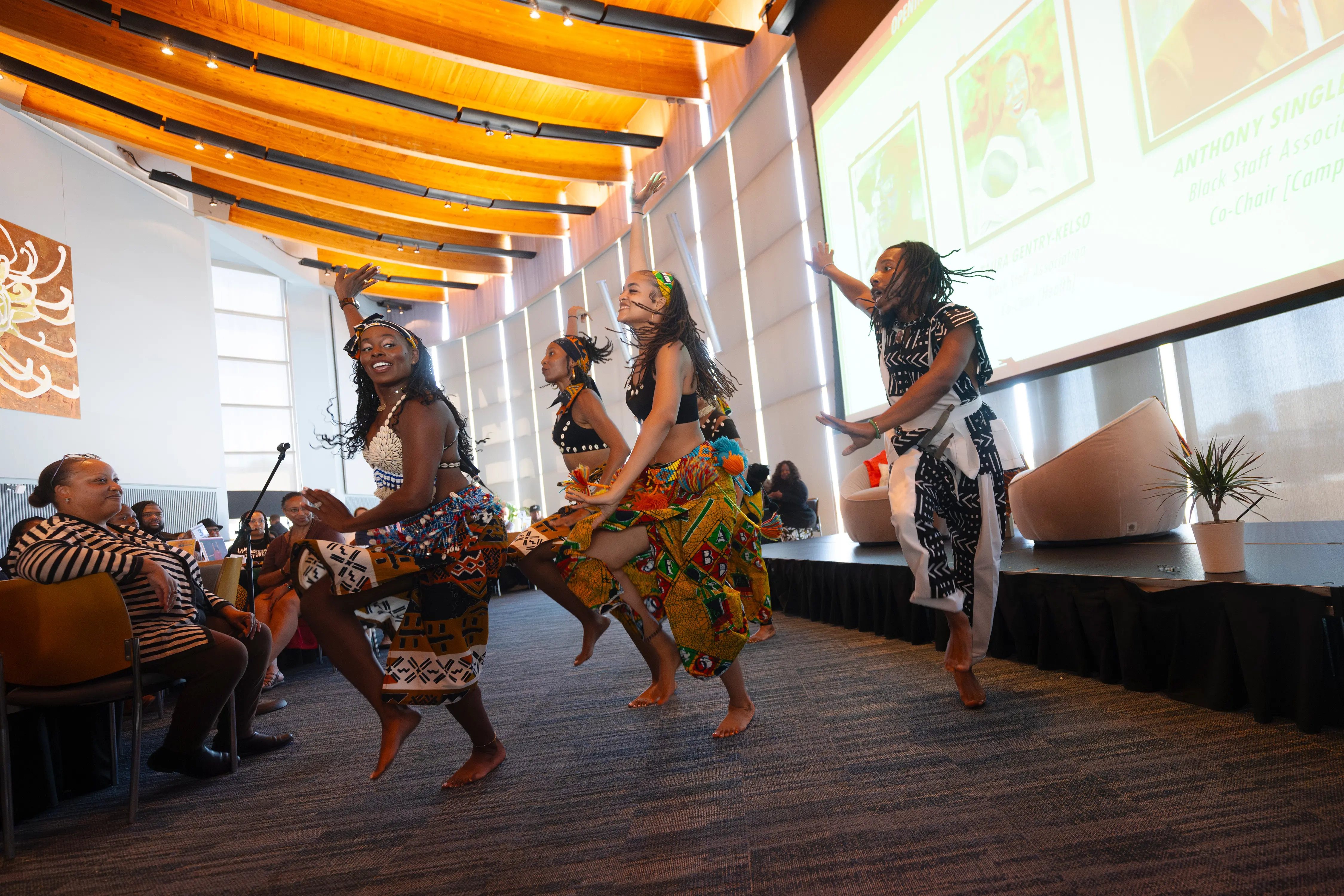 people dancing in traditional West African attire