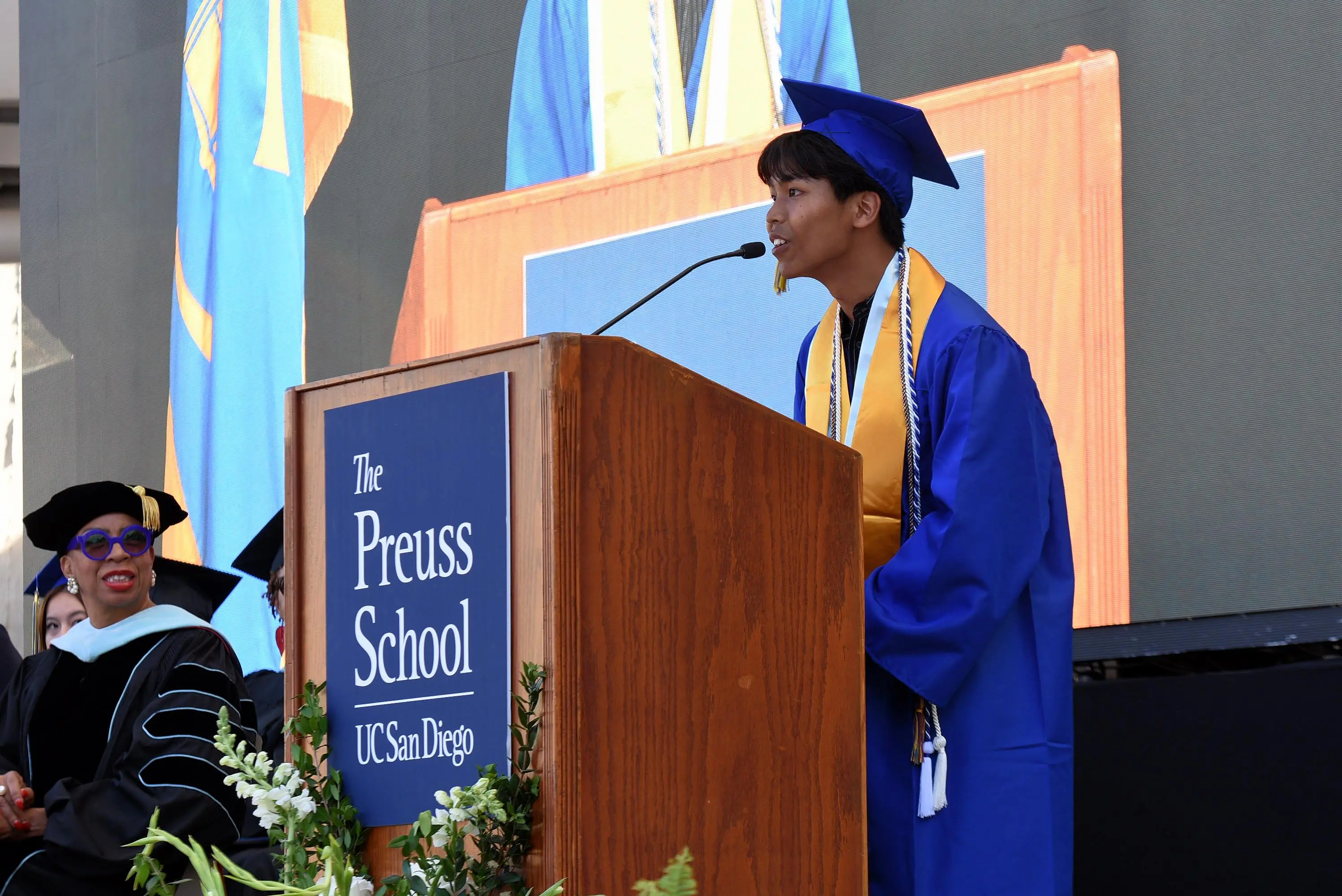 student speaks at podium