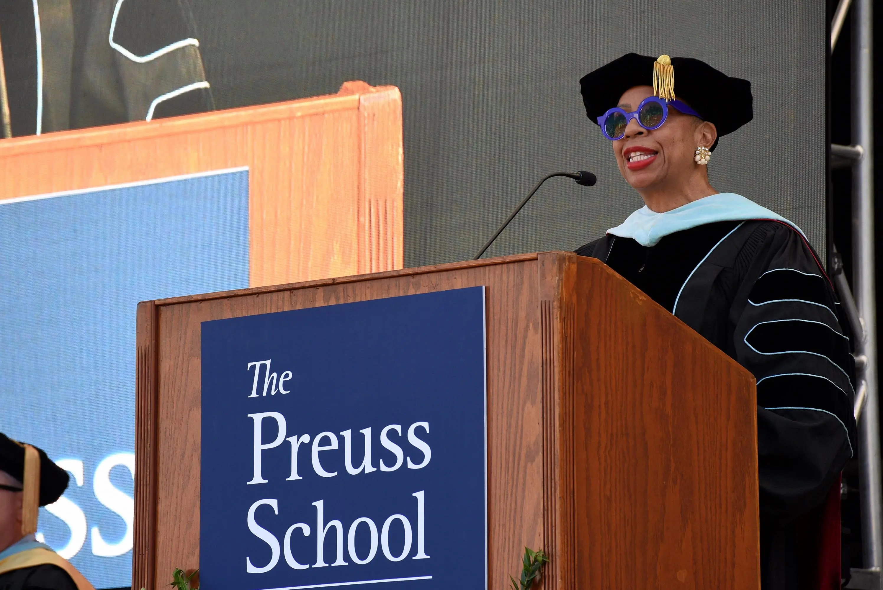administrator speaks at podium