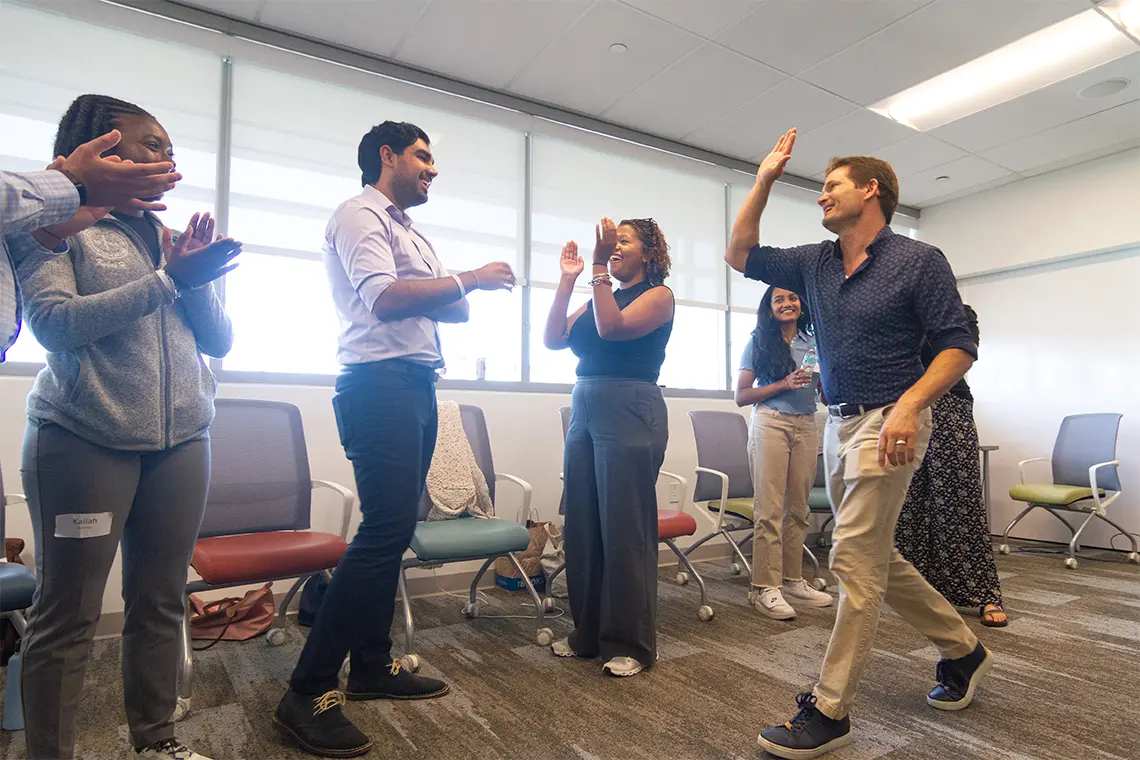 students in a workshop playing interactive games