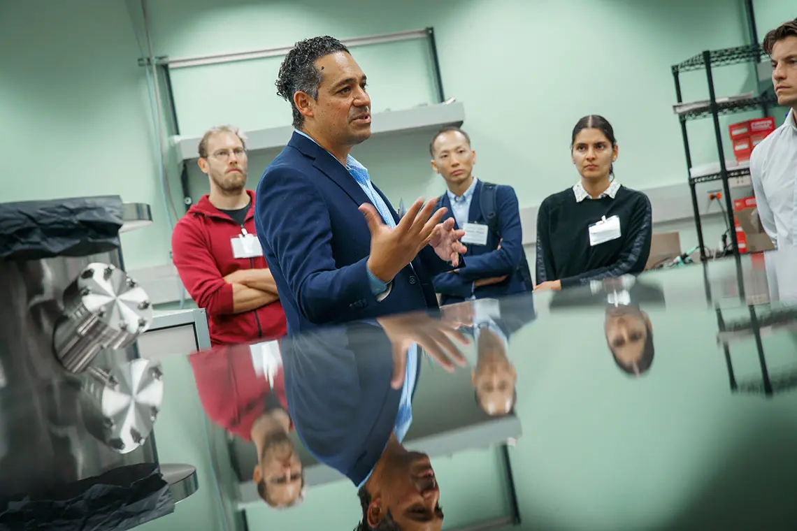 A professor giving a tour of a lab. 