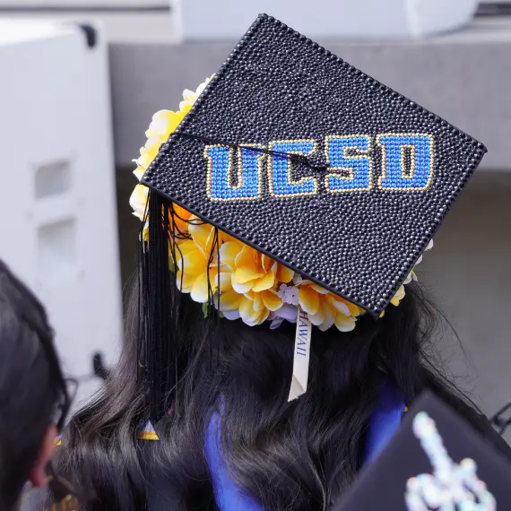 Photo of a graduation cap that reads: UCSD
