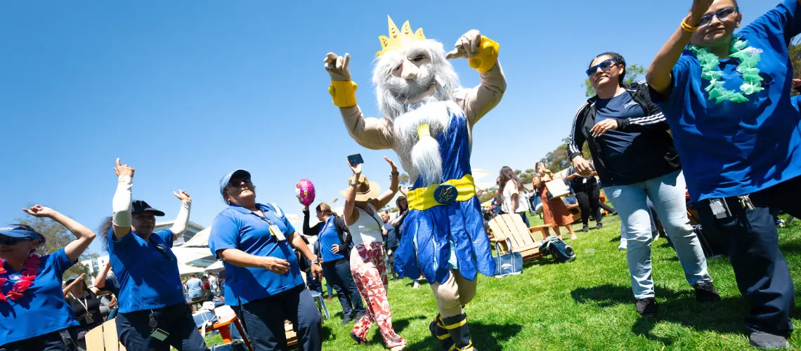 King Triton dances in the crowd.