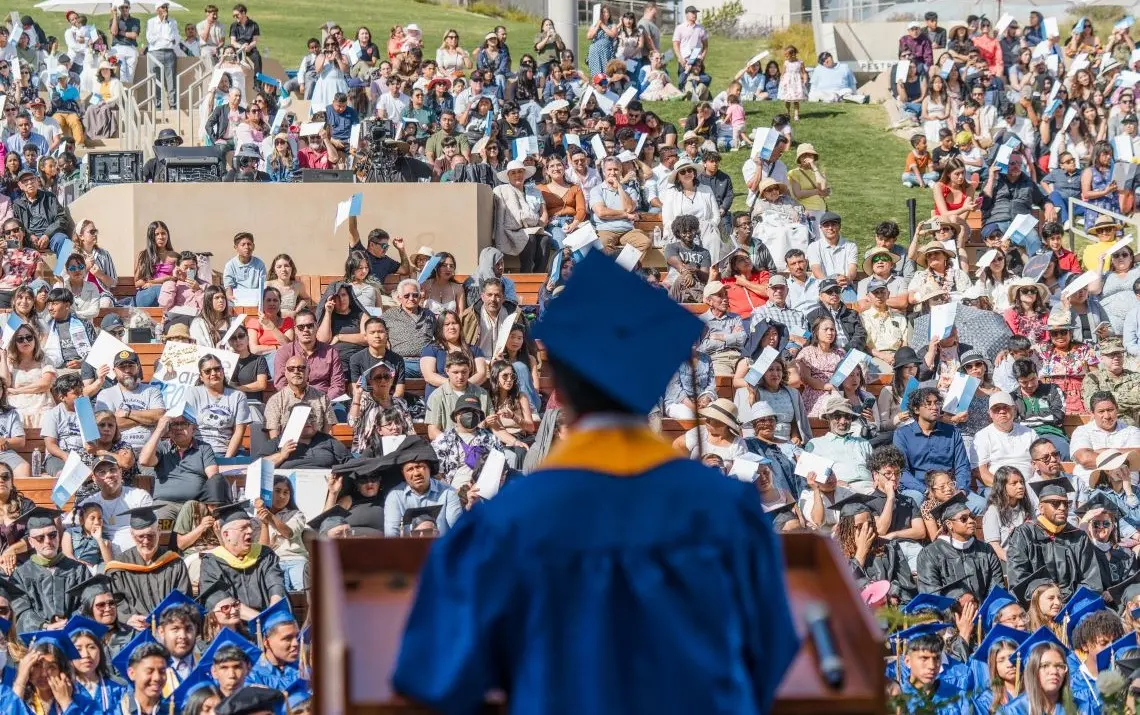 A photo taken from behind the Valedictorian to show the crowd during his speech