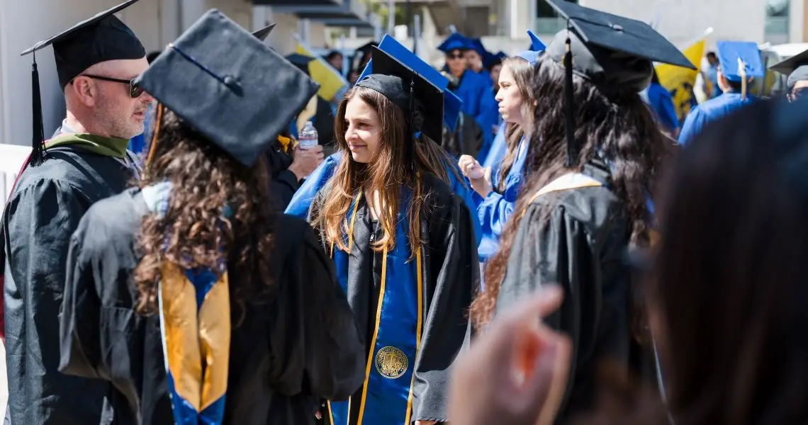 Students standing in graduation attire