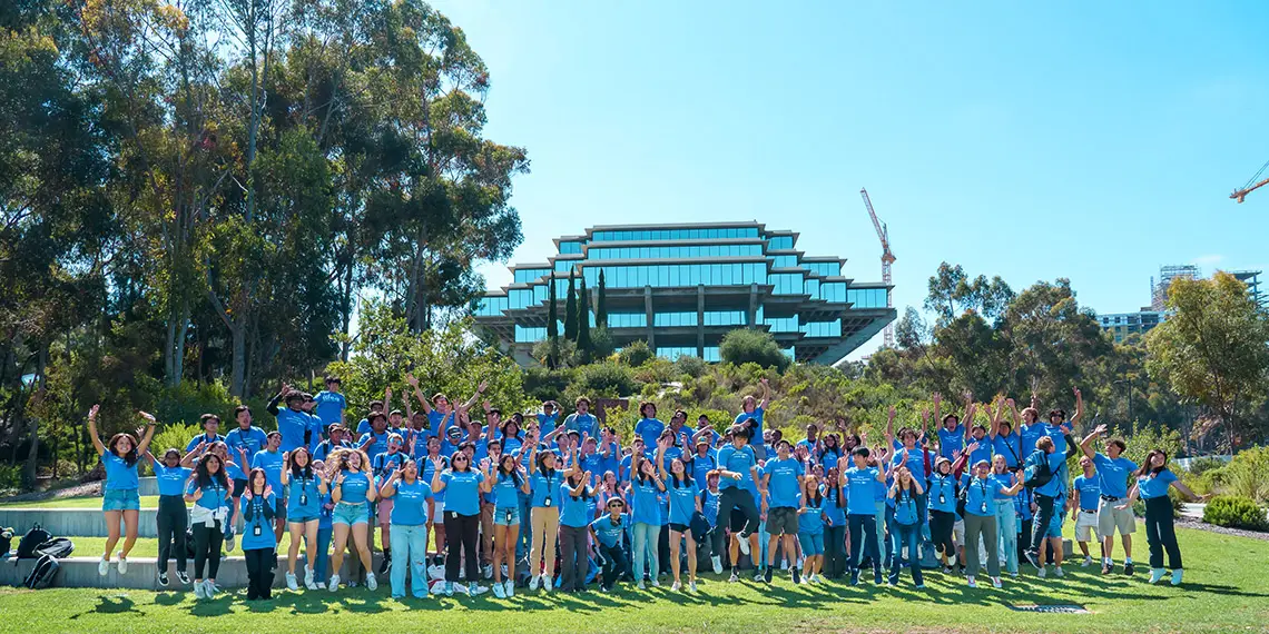 Summer Engineering Institute student participants jump in front of Geisel Library.