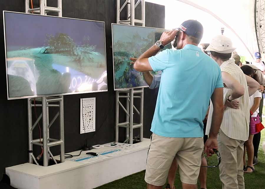 Image of Visitors trying the Bermuda 100 technology