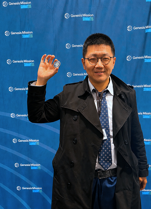 Aobo Li holding Genesis coin