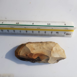 A recovered Neolithic flint adze.